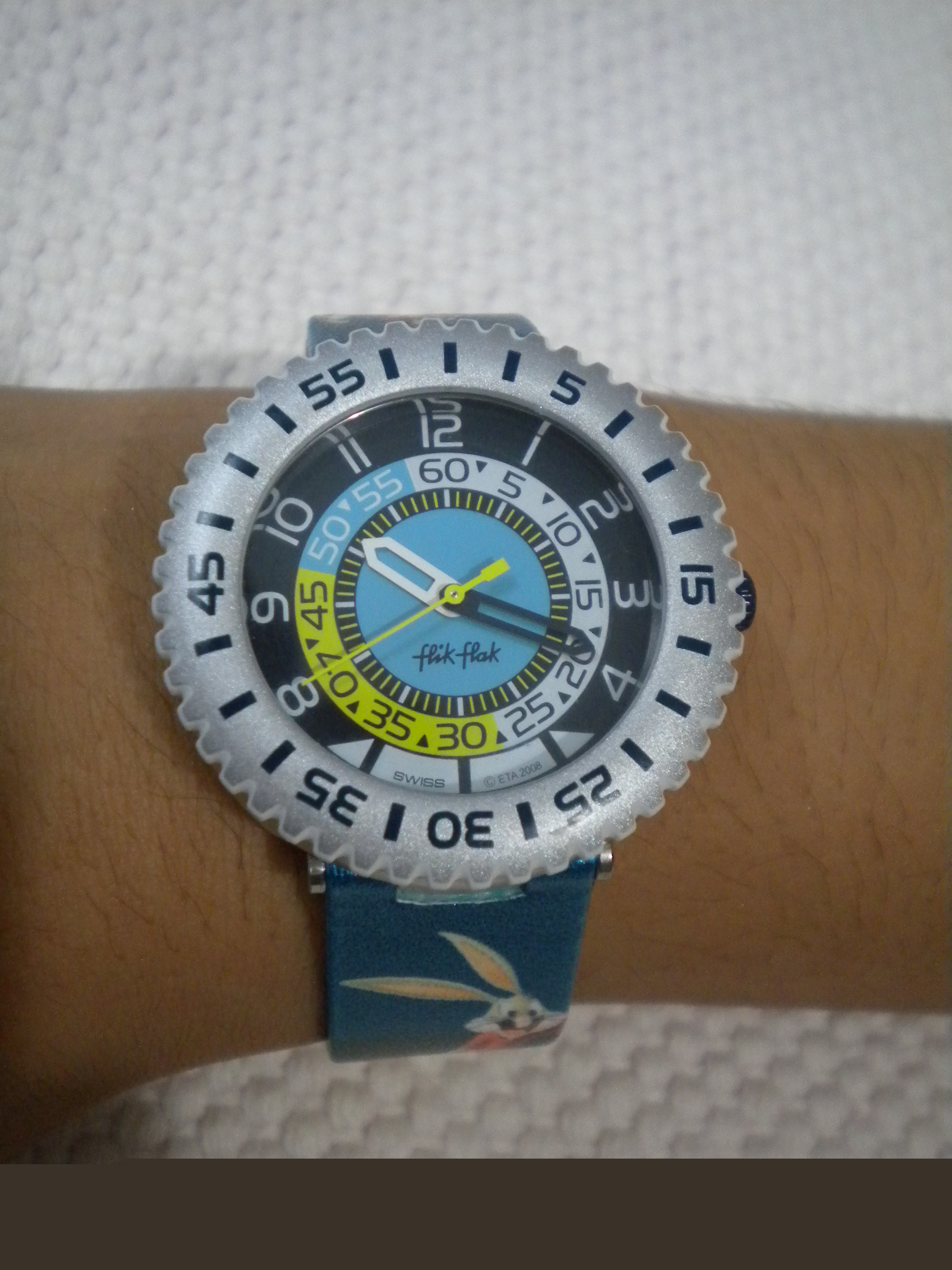 The PSPE Extender™ on a wrist, displaying the time